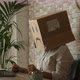Internet computer security concept with worried carton box on the head. People working on laptop - VideoHive Item for Sale