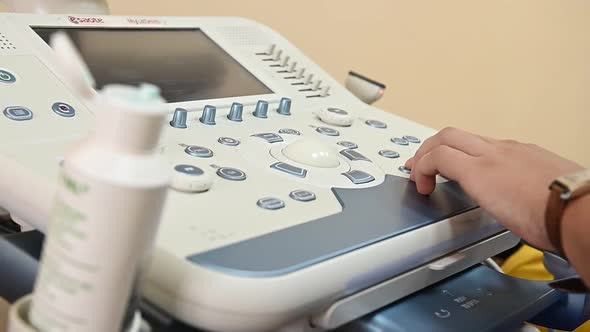 The Doctor Makes an Ultrasound To the Patient and Examines the Organs on the Monitor