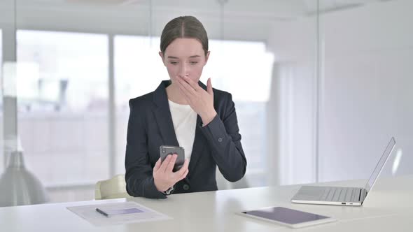 Hardworking Young Businesswoman Having Failure on Smartphone 