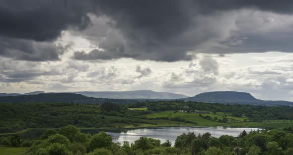 Time Lapse of nature landscape of hills and lake on a cloudy day in Ireland.