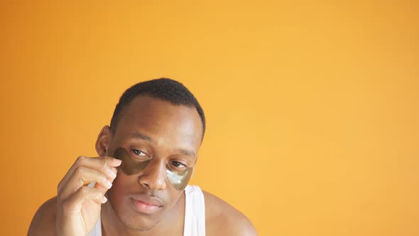 African American Wants Wellgroomed Skin Around the Eyes He Uses Collagen Patches Under the Eyes