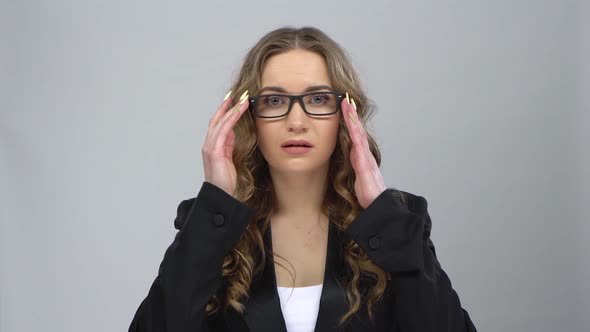 Bussines Girl in Glasses Looks in Surprise at Camera and Is Shocked By What She Saw