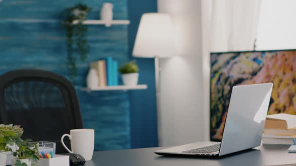 Empty Workplace Home Office with Modern Design and Laptop Placed on Desk