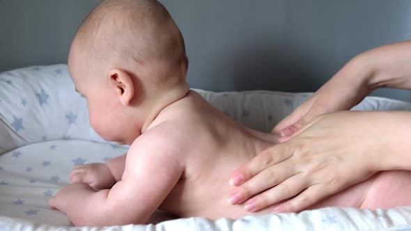 Mother Giving Massage To Little Child