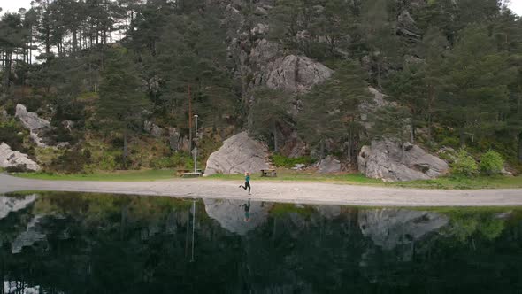 Woman on the side of a lake - 4K