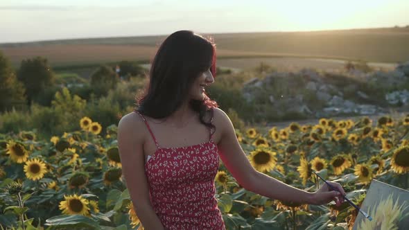 Handsome Man Comes and Presents a Sunflower to His Painting Girl in Field