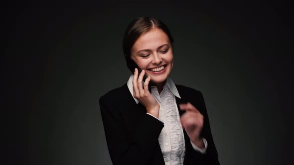 Attractive Brunette Bussines Woman Talking on Phone and Smiling