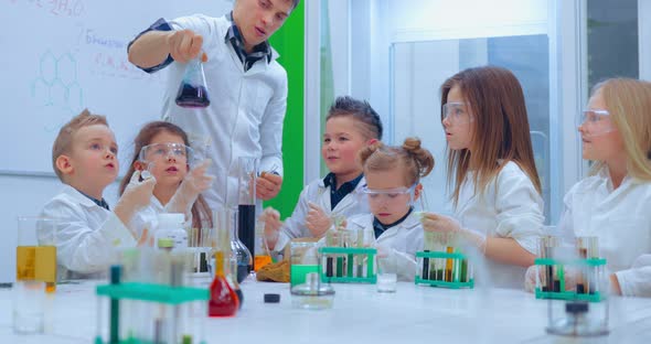 Young Boys and Girls is Making Chemistry Experiments