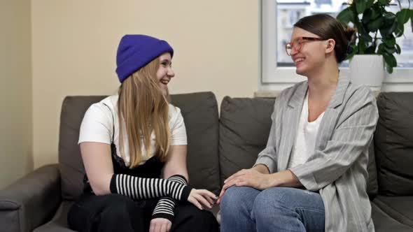 Young Woman with Teenage Daughter