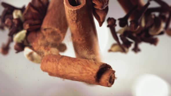 Clash of Flying Spices and Cinnamon Stick Cracking in Slow Motion