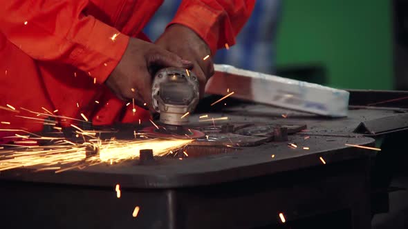 Professional Mechanic is Cutting Steel Metal