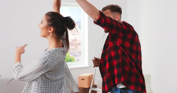 Close Up of Caucasian Young Cheerful Cute Married Family Wife and Husband Having Fun During