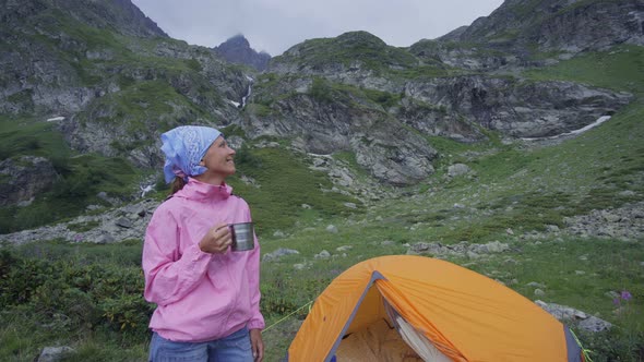 Woman Backpacker Hiking in Mountains 023