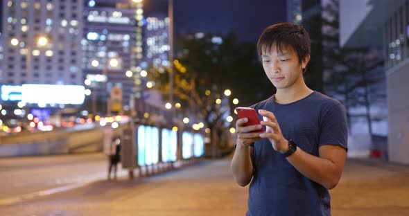 Man use of mobile phone at night