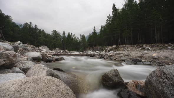 Arshan Mountain River Water in A Mountain River Like Foam, Long Exposure. Timelapse.