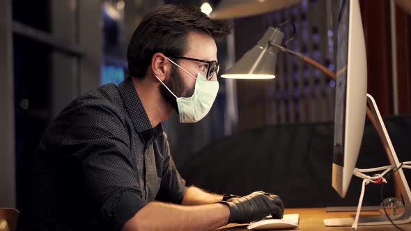 Man In Face Mask Working In Office. Businessman In Mask Protection Epidemic Coronavirus. Webinar.