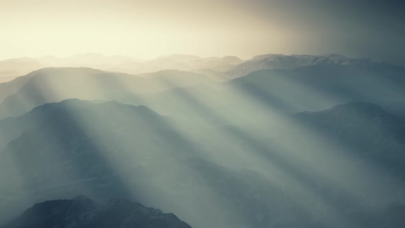 Black Rocky Mountain Silhouette in Deep Fog alt