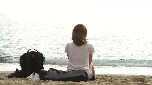 Girl Sitting By the Sea on the Sand in Alanya, Turkey