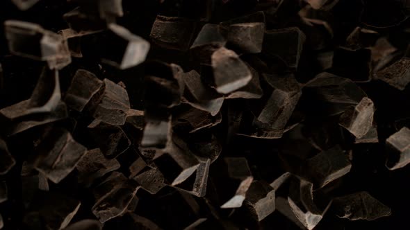Super Slow Motion Shot of Raw Chocolate Chunks After Being Exploded Towards The Camera at 1000Fps.