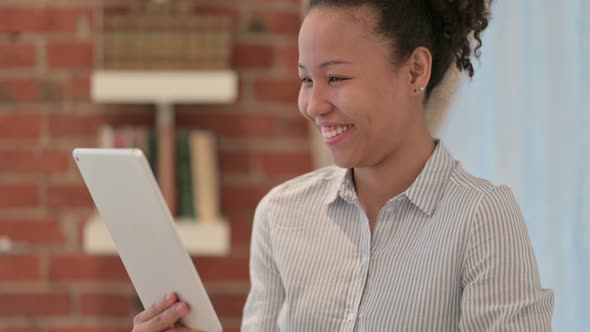 Portrait of African American Woman Doing Video Call on Tablet