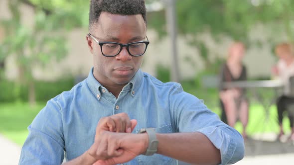 Portrait of African Man Using Smartwatch