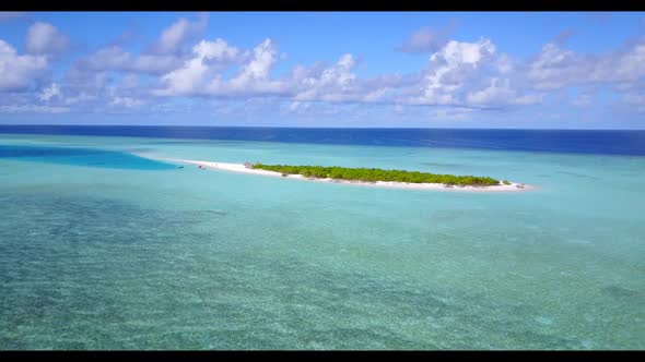Aerial drone shot scenery of beautiful island beach lifestyle by blue sea and white sandy background