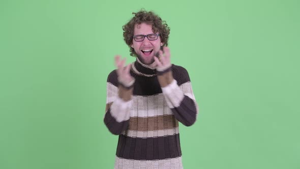 Happy Young Bearded Man Looking Surprised