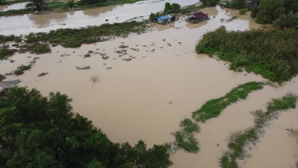 Aerial view flood near the Malays kampung house beside river