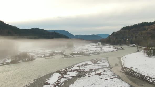 Aerial View of Chilliwack River with Snow During Winter Season