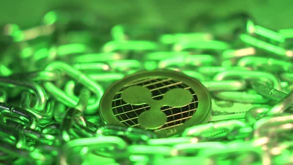 Crypto Coin Ripple Lies in Silver Chain with Green Light. Blockchain Technology. Popular
