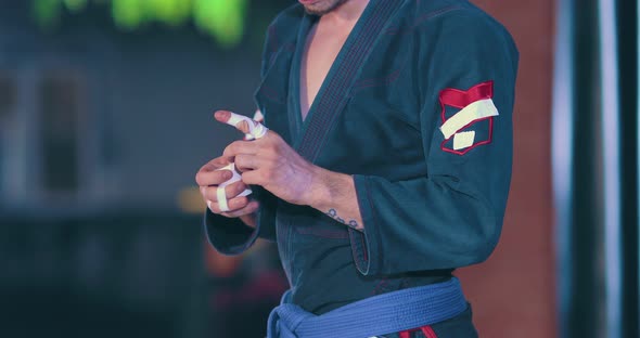 Athlete Closes His Fingers Before the Fight