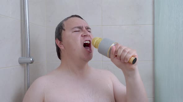 Emotional Plump Man Sings Karaoke with Gold Microphone Taking Shower in Bathroom