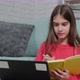 Beautiful Girl Making Notes of Online Lecture Lesson Sitting on the Floor Carpet - VideoHive Item for Sale