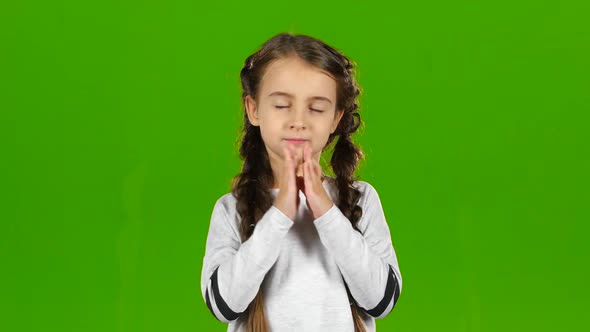 Baby Crosses His Fingers in His Arms. Green Screen