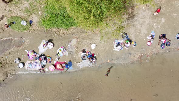 Haitian People Doing The Laundry By The Dajabon River, Also Called Massacre River In The Dominican R