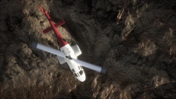 Slow Motion Helicopter Above Rocky Desert