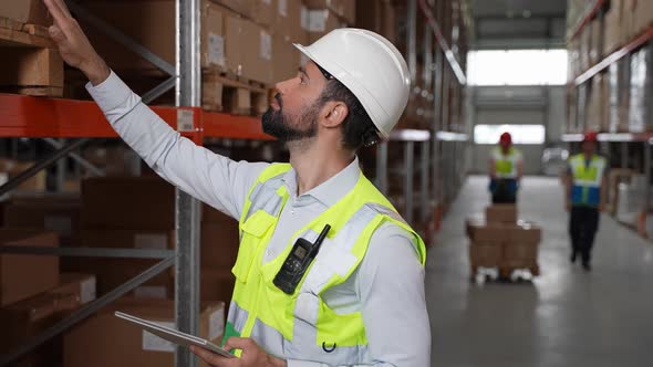 Serious Inventory Manager During Work in Warehouse