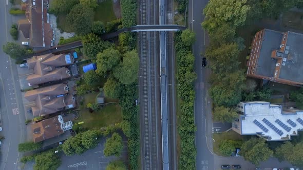 Bird's Eye View of a Commuter Train Departing a Station