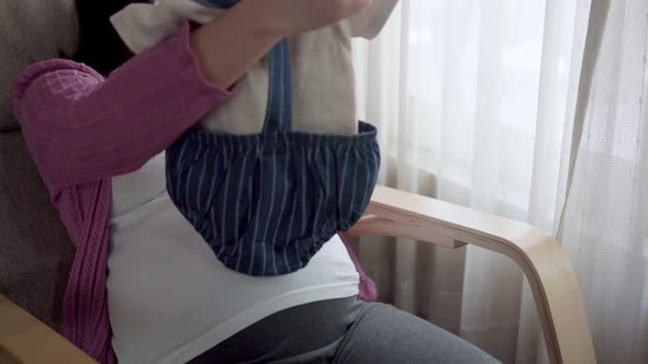 Happy Pregnant Woman and Expecting Baby at Home