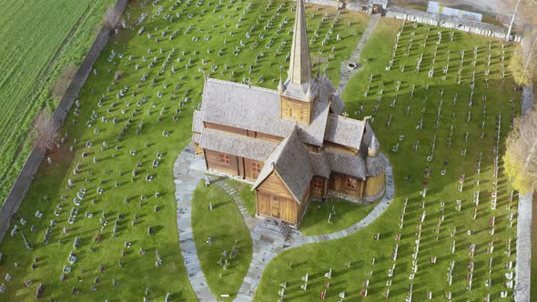 Verdant Landscape Of Graveyard With Lom Stave Church In Lom Municipality, Innlandet County, Norway.