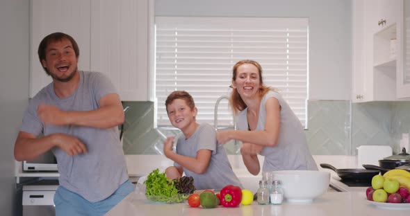 Funny Happy Family and Cute Children Having Fun Dancing in Kitchen Together Active Mom Dad Enjoying