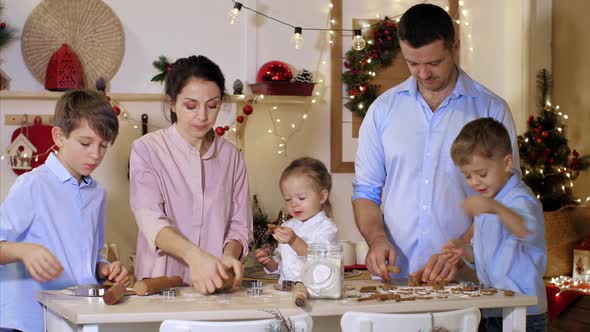 Having Many Children Family is Making Cookies Together for Christmas