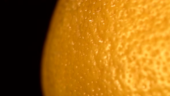 Side Ripe Orange Isolated on Black, Rotation, Close Up