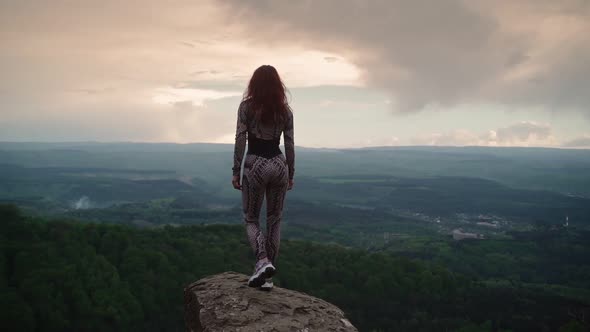 Slim Girl Stands on Top Mountain and Raises Her Arms Sides Stunning Landscape