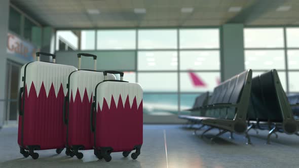 Suitcases with Flag of Qatar in the Airport Terminal