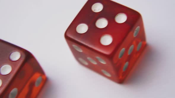 Bright Red Dices with Spots on Sides on White Background