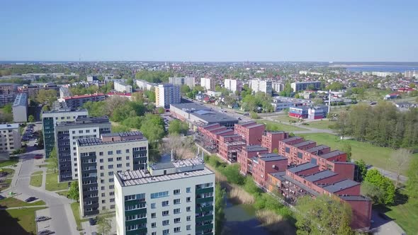 Aerial view of crowded residential district apartment buildings on a sunny summer day, renovated and