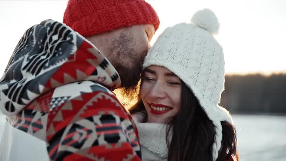 Happy Young Couple on Romantic Date Dating in Winter Outside at Xmas Holidays Concept