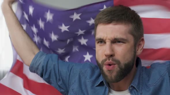 Man Waving American Flag, Celebrating Victory of Presidential Candidate, Slow-Mo