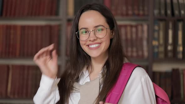 Smiling Female Student in Library